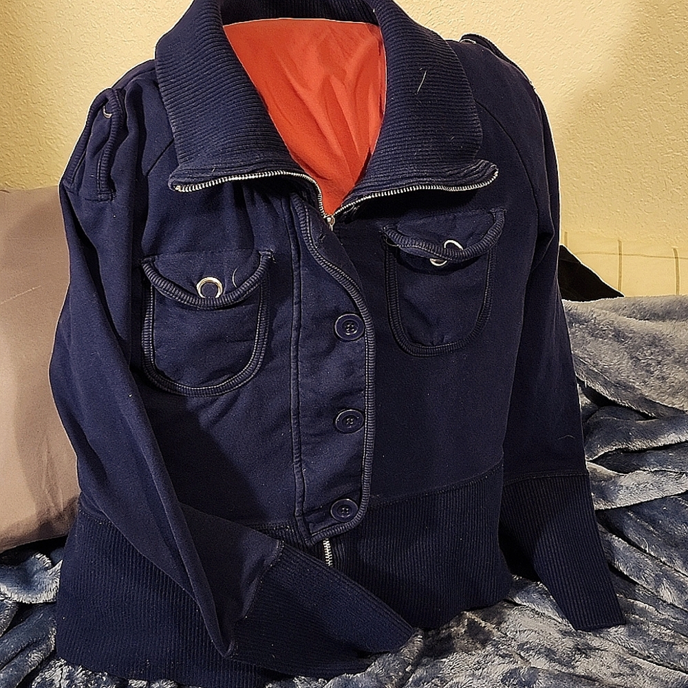 A light sweater lights. Royal blue Good to fair condition